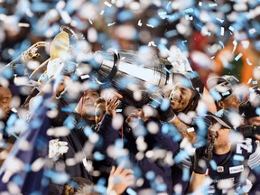 The Toronto Argonauts celebrate as they hoist the Grey Cup after defeating the Calgary Stampeders in the 105th Grey Cup, Sunday, November 26, 2017 in Ottawa. Maple Leaf Sports & Entertainment has struck a deal to buy the CFL's Toronto Argonauts.THE CANADIAN PRESS/Sean Kilpatrick ORG XMIT: CPT136