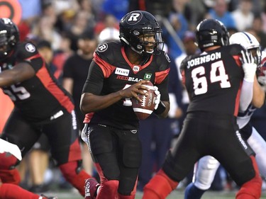 Ottawa Redblacks quarterback Dominique Davis (4) prepares to pass the ball during first half of pre-season CFL action against the Montreal Alouettes in Ottawa on Thursday, May 31, 2018.