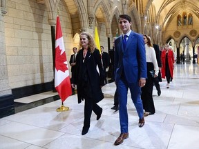 Canada's incoming Governor General Julie Payette walks with Prime Minister Justin Trudeau as she arrives on Parliament Hill in Ottawa on Monday, Oct. 2, 2017, for her installation ceremony.
