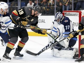 Winnipeg Jets goaltender Connor Hellebuyck blocks a shot by the Vegas Golden Knights' Reilly Smith during the second period of Game 3 of the NHL hockey playoffs Western Conference final on Wednesday, May 16, 2018, in Las Vegas.