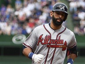 Jose Bautista of the Atlanta Braves runs the bases after hitting a three-run homer against the Chicago Cubs during the fifth inning while wearing the #42 to commemorate Jackie Robinson Day on May 14, 2018 at Wrigley Field in Chicago, Illinois. (David Banks/Getty Images)