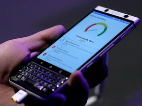 A man touches the new BlackBerry KEYone before the Mobile World Congress in Barcelona, Spain, Saturday, Feb. 25, 2017. According to online measurement firm comScore, there aren't many holdouts left in Canada still using a BlackBerry. THE CANADIAN PRESS/AP/Manu Fernandez ORG XMIT: CPT111