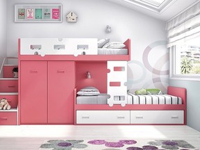 Bunk beds these days take a variety of forms and no longer tend to be stacked one on top of the other. Here, for example, there are cupboards positioned between the two beds, and storage drawers under one of the beds as well as in the stairs to the left of the cupboards.