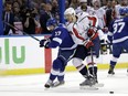 Tampa Bay Lightning left wing Alex Killorn knocks Washington Capitals defenceman John Carlson off the puck during Game 2 last night.(AP)