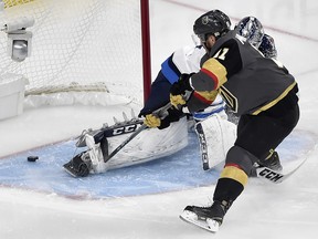 Vegas Golden Knights centre Jonathan Marchessault beats Winnipeg Jets goaltender Connor Hellebuyck Wednesday, May 16, 2018, in Las Vegas. (AP Photo/David Becker)