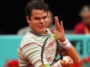 Milos Raonic plays a forehand against Grigor Dimitrov of Bulgaria in their second round match during day four of the Mutua Madrid Open tennis tournament at the Caja Magica on May 8, 2018 in Madrid, Spain. (Clive Brunskill/Getty Images)