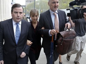 Actress Allison Mack, centre, arrives with her legal team to Brooklyn Federal Court, Friday May 4, 2018, in New York.