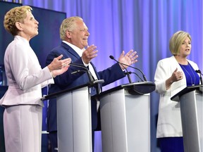 Ontario Liberal Leader Kathleen Wynne, left to right, Ontario Progressive Conservative Leader Doug Ford and Ontario NDP Leader Andrea Horwath participate during the third and final televised debate of the provincial election campaign in Toronto, Sunday, May 27, 2018.