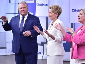 Liberal Premier Kathleen Wynne, centre, Progressive Conservative Leader Doug Ford, left, and NDP Leader Andrea Horwath take part in the Ontario Leaders debate.