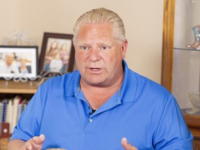 Ontario Progressive Conservative leader Doug Ford at a campaign stop in the kitchen of Bill and Linda Reid in Reeces Corners, Ont. on Wednesday. (Geoff Robins/The Canadian Press)