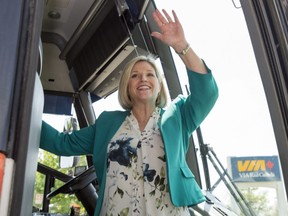 Ontario NDP Leader Andrea Horwath waves from her campaign bus at an event in St. Catharines, Ont. on Thursday, May 17, 2018. Frank Gunn/The Canadian Press