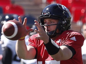 Quarterback Danny Collins snags the football during training camp drills at TD Place stadium earlier this week. Collins is expected to receiving playing time during Thursday's home pre-season game against the Alouettes.    Tony Caldwell
