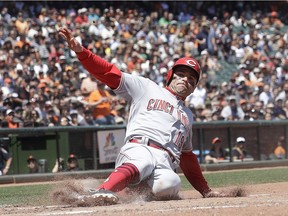 The Cincinnati Reds' Joey Votto scores against the San Francisco Giants during the fifth inning of a baseball game in San Francisco, Wednesday, May 16, 2018.