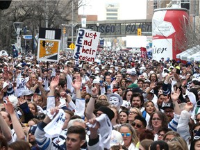 Fans cheer during the Whiteout Street Party outside Bell MTS Centre in Winnipeg on Fri., April 20, 2018.