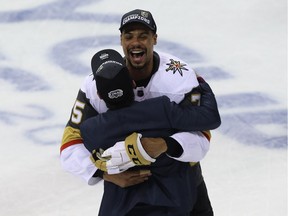 Vegas Golden Knights forward Ryan Reaves, from Winnipeg, hugs a team member after knocking off the Winnipeg Jets in the Western Conference final in Winnipeg on Sun., May 20, 2018.