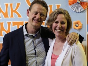 Joel Harden of the NDP and his wife, Clare Roscoe, celebrate Harden's victory over longtime Ottawa Centre Liberal MPP Yasir Naqvi on Thursday night.