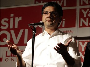 Liberal MPP Yasir Naqvi gives a speech at the Carleton Tavern with his wife Christine McMillan after losing the Ottawa Centre riding to the NDP's Joel Harden, in Ottawa on June 7, 2018. Naqvi has held this riding since 2007, and most recently assumed the position of attorney general in 2016 under Kathleen Wynne.