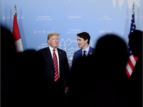 Prime Minister Justin Trudeau takes part in a meeting with U.S. President Donald Trump during the G7 Leaders Summit in La Malbaie, Que., on Friday, June 8, 2018.
