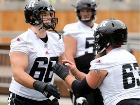 Offensive lineman Nolan MacMillian (left) during Ottawa Redblacks practice Thursday (June 14, 2018) at TD Place.