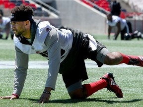Receiver-returner Diontae Spencer warms up before Redblacks practice at TD Place stadium on Tuesday.