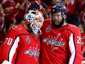 Washington Capitals winger Devante Smith-Pelly, right, celebrates the Game 4 win over Vegas with goaltender Braden Holtby.