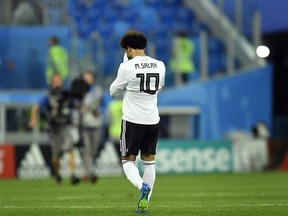 Egypt's Mohamed Salah leaves the pitch after Tuesday's loss to Russia. (AP PHOTO)
