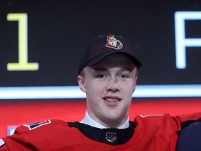 Jacob Bernard-Docker poses after being selected twenty-sixth overall by the Ottawa Senators on Friday. (GETTY IMAGES)