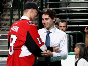 Senators' Brady Tkachuk hugs Vancouver pick Quinton Hughes during the draft on Friday. (GETTY IMAGES)
