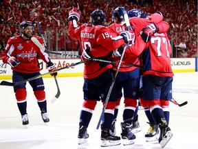 John Carlson #74 of the Washington Capitals is congratulated by his teammates after scoring a second-period goal against the Vegas Golden Knights in Game Four of the 2018 NHL Stanley Cup Final at Capital One Arena on June 4, 2018 in Washington, DC.