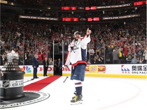 Capitals captain Alex Ovechkin points to teammates after being awarded the Conn Smythe Trophy as the NHL's playoff MVP.