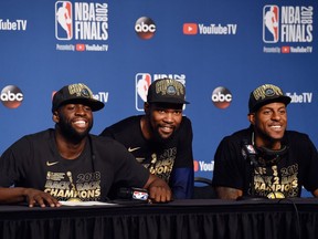 Draymond Green, left, NBA Finals MVP Kevin Durant, middle, and Andre Iguodala of the Warriors speak to the media after Game 4 on Friday night in Cleveland.