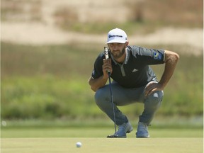 Dustin Johnson lines up a putt on the sixth green during the second round of the 2018 U.S. Open at Shinnecock Hills Golf Club on Friday.