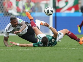 Jerome Boateng of Germany battles for the ball with Javier Hernandez of Mexico during the 2018 FIFA World Cup Russia group F match between Germany and Mexico at Luzhniki Stadium on June 17, 2018 in Moscow, Russia.