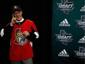 Jacob Bernard-Docker speaks on the phone after being selected 26th overall by the Senators on Friday night.