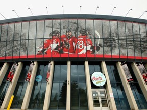 Storm clouds gathered over Canadian Tire Centre Wednesday (June 13, 2018), where images of teammates Erik Karlsson and Mike Hoffman hang together outside.