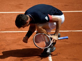 Austria's Dominic Thiem celebrates winning the second set against Italy's Marco Cecchinato during their men's singles semi-final match on Friday.