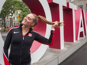 Pole vaulter Alysha Newman is recognized by some just because of her celebration for winning Commonwealth Games gold in April. Here she poses for a photo in the ByWard Market earlier this week. Wayne Cuddington/Postmedia