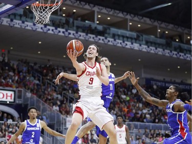 Canada's Kelly Olynyk goes to the basket against the Dominican Republic.