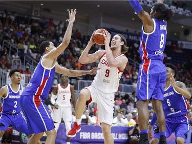 Canada's Kelly Olynyk goes to the basket against the Dominican Republic during Friday's game at Toronto.