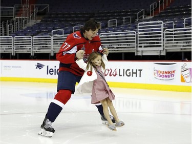 Before the Capitals parade and victory rally, there was a photo shoot inside the Capital One arena, and forward T.J. Oshie took a spin on the ice with his daughter, Lyla.