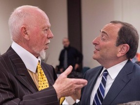 NHL Commissioner Gary Bettman (right) chats with Don Cherry before discussing the launch of the upcoming NHL season in Toronto on Sept. 22, 2014.