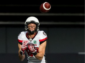 Redblacks receiver Greg Ellingson makes a reception against the Lions during a CFL game on Oct. 7, 2017.