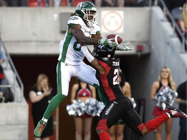 Ottawa Redblacks' Corey Tindal (28) prevents Saskatchewan Roughriders' Naaman Roosevelt (82) from completing a catch, during first half CFL action in Ottawa on Thursday, June 21, 2018.