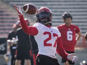 Calgary Stampeders' Tunde Adeleke catches a football on opening day of training camp in Calgary, Sunday, May 20, 2018.
