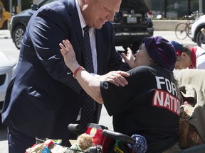 Ontario Premier-designate Doug Ford arrives at the Postmedia offices in Toronto for an interview with the Toronto Sun and greets supporters on his way into the building on Friday June 8, 2018. (Stan Behal/Toronto Sun/Postmedia Network)