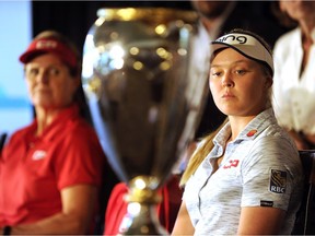 Canadian golfers Lorie Kane, left and Brooke Henderson take part in a media conference for the CP Women's Open at the Wascana Country Club in Regina on Monday.