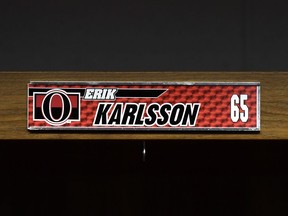 Erik Karlsson's nameplate is seen in the Senators locker room during the team's season wrap-up on April 9.