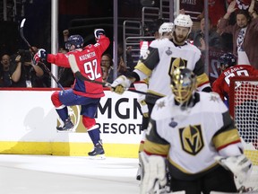 Washington Capitals forward Evgeny Kuznetsov, back left, of Russia, celebrates his goal against Vegas Golden Knights goaltender Marc-Andre Fleury, front right, during the second period in Game 3 of the NHL hockey Stanley Cup Final, Saturday, June 2, 2018, in Washington. (AP Photo/Alex Brandon) ORG XMIT: VZN141