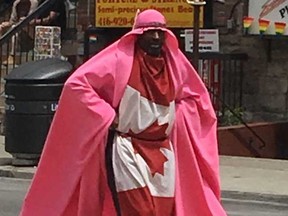 Kevin Clarke rollerblades through the Village as the city gets set for Pride weekend. (Joe Warmington/Toronto Sun/Postmedia Network)