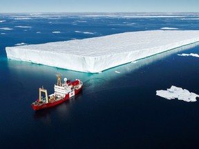 The Canada C3 vessel, the Polar Prince, sails alongside an enormous tabular ice berg, the size of a city block, that had broken free from the Greenland ice shelf. The drone shots of the ship against the stark Arctic wilderness are among the most beautiful scenes in the C3 Imax film showing this summer at the Canadian Museum of History. (handout)